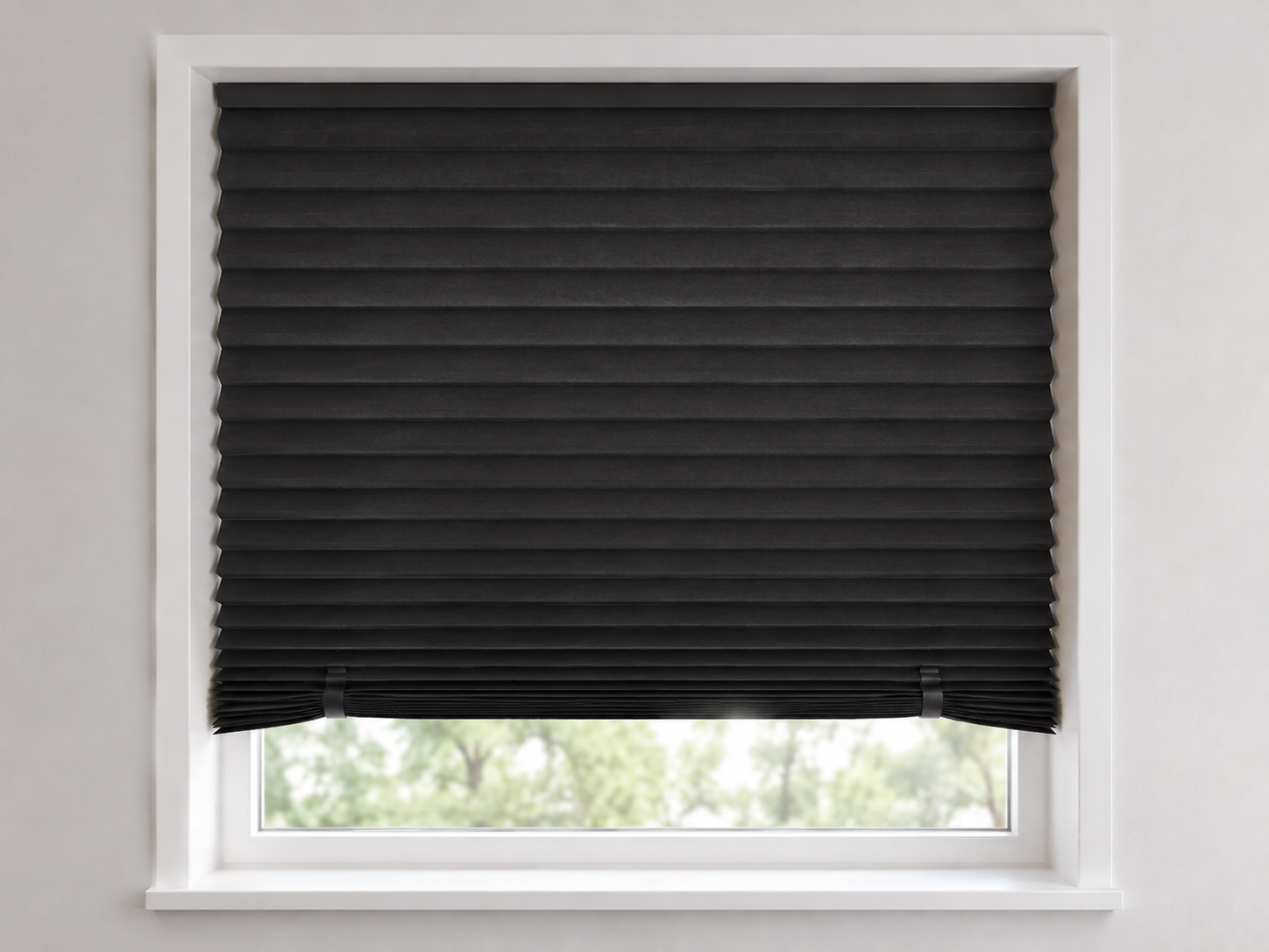 Original unbranded format illustration of a black pleated paper shade inside a white window recess with two small clips holding the lower folds.