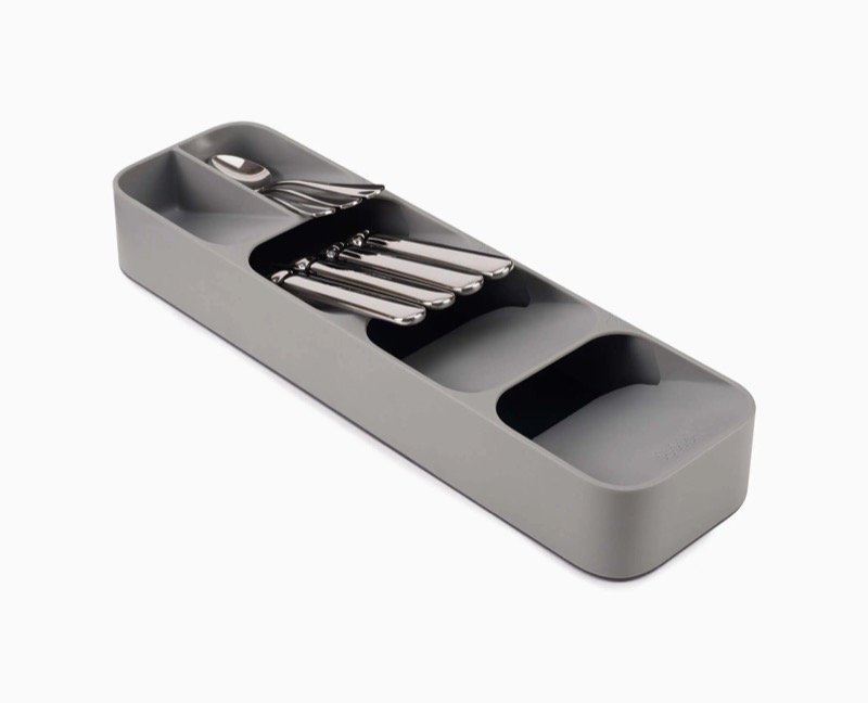 Gray Joseph Joseph DrawerStore compact cutlery organizer SKU 85119 holding forks and spoons on a white background.