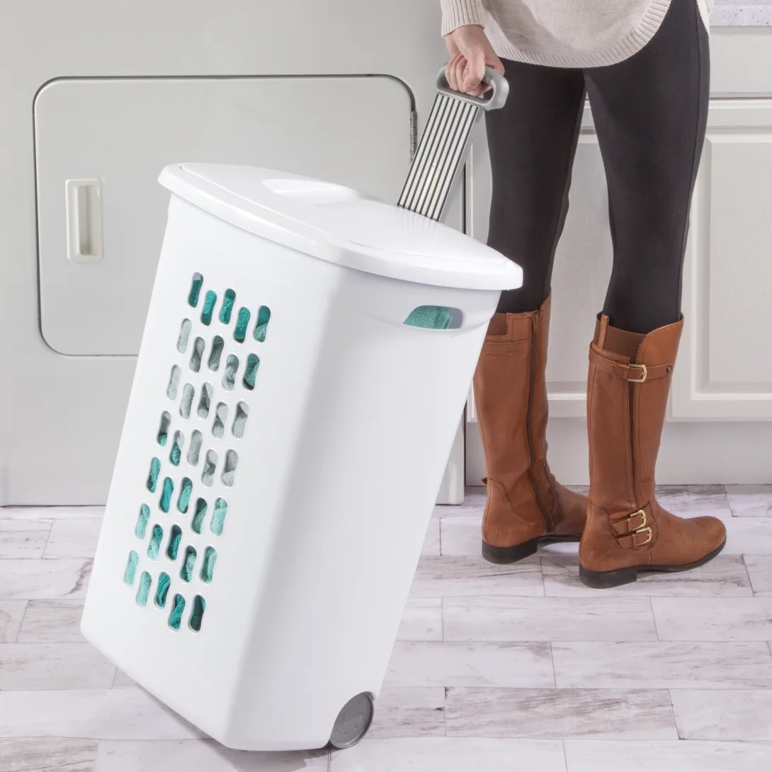 White Sterilite Ultra model 1222 rigid wheeled hamper with ventilation openings, lid, and raised pull handle.