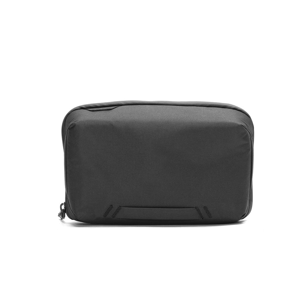 Official black Peak Design Regular Tech Pouch shown open with its structured internal organization on a white background.