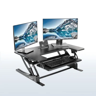 VIVO manufacturer photo of DESK-V000V with display accessories; monitors and keyboard are not included.