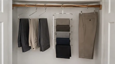 Three pants-hanger formats in a small closet: separate open bars, a five-tier vertical stack, and an adjustable clip hanger.