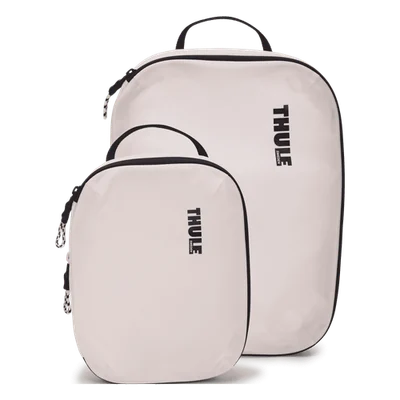 White Thule Compression Cube Set model 3204860 shown as one small and one medium packing cube.