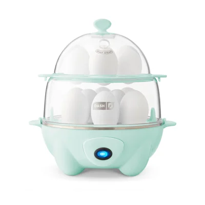 Dash Deluxe DEC012 egg cooker in aqua with a clear stacked lid and matching accessories.
